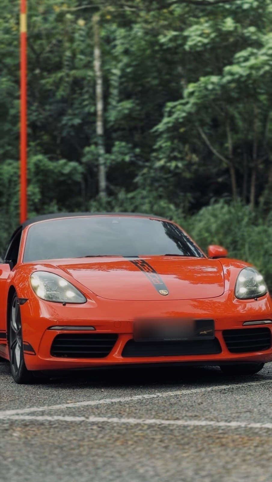 Rent a 2022 Porsche 718 Boxster in Kuala Lumpur — Mid-engined open-top perfection.
